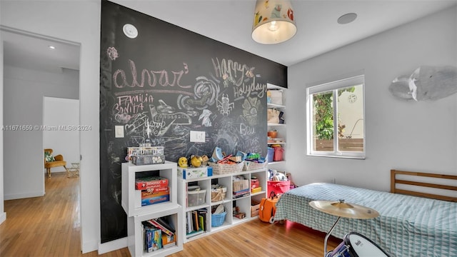 playroom with hardwood / wood-style floors