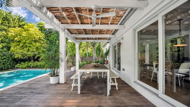 exterior space featuring ceiling fan and a swimming pool side deck