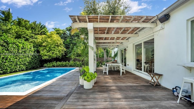 view of pool with a deck and a pergola