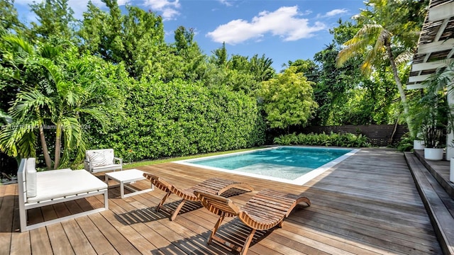 view of swimming pool featuring a deck