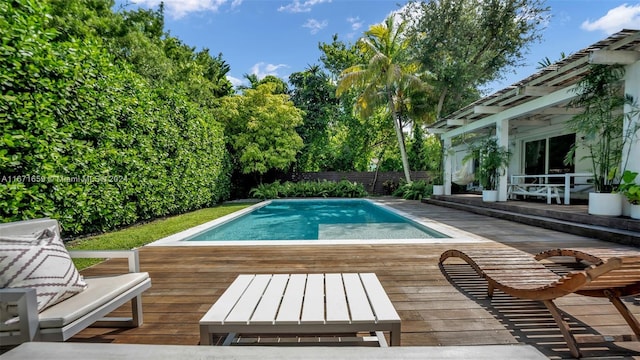 view of swimming pool with a deck