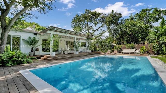 view of swimming pool with a wooden deck