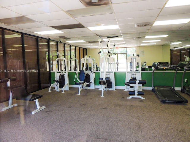 workout area with a paneled ceiling