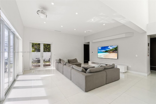 living room with french doors and light tile patterned flooring