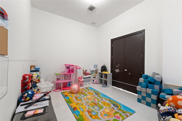 recreation room with light tile patterned floors