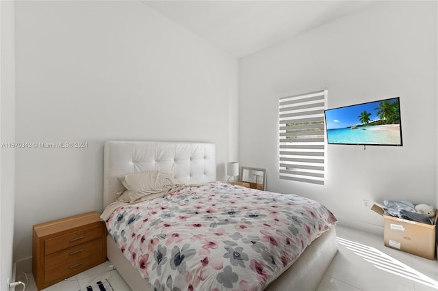 bedroom with light tile patterned floors