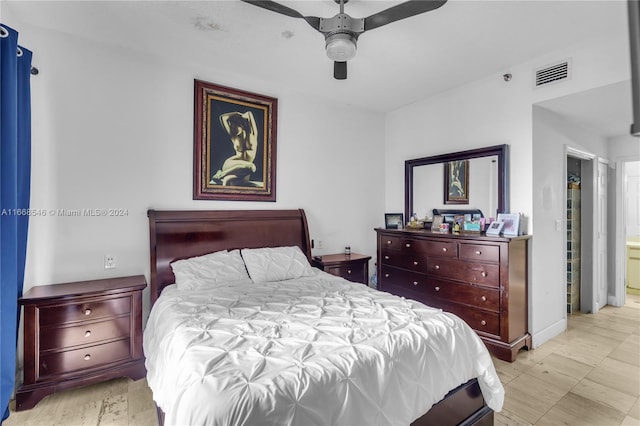 bedroom with connected bathroom and ceiling fan