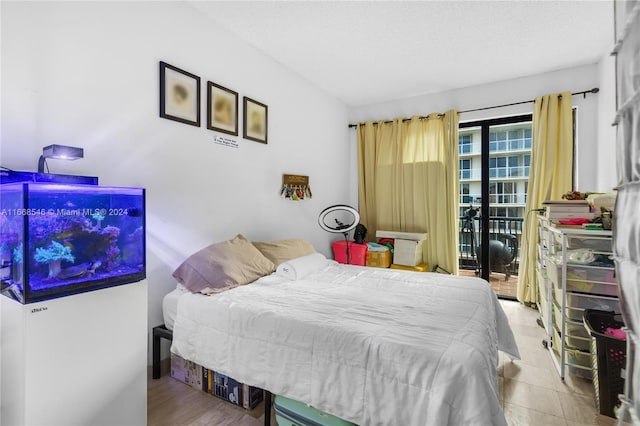 bedroom with hardwood / wood-style floors