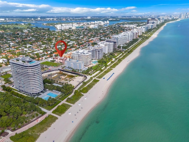 drone / aerial view with a view of the beach and a water view