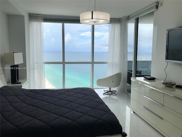 tiled bedroom featuring expansive windows