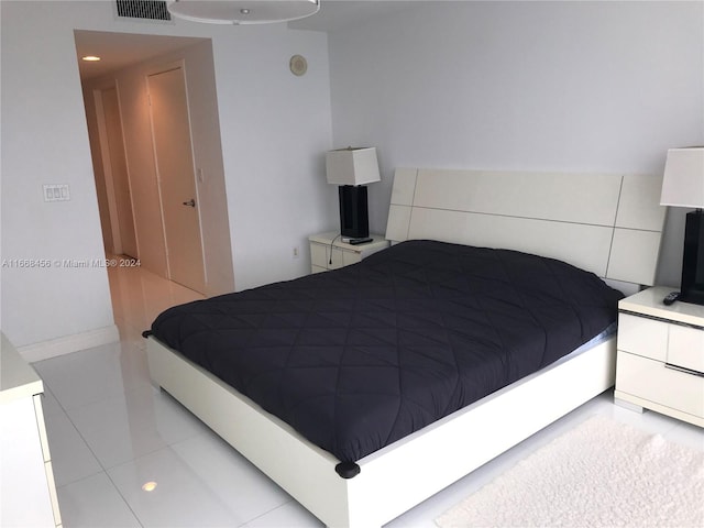 bedroom featuring light tile patterned floors