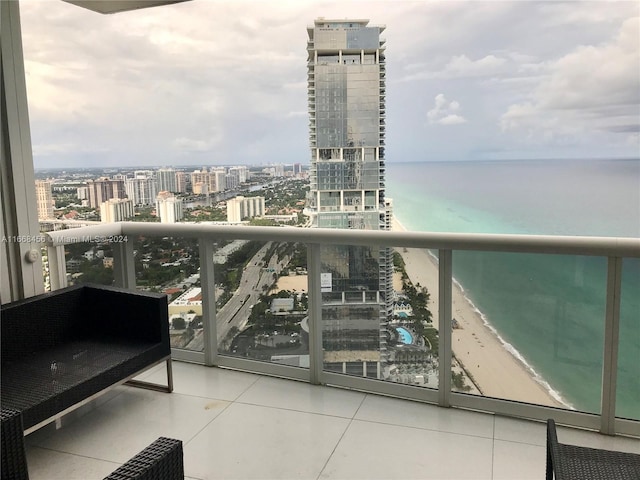 balcony with a view of the beach and a water view