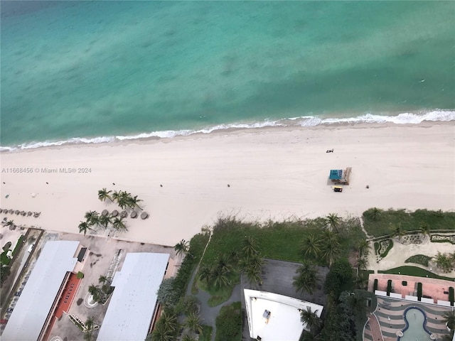 aerial view featuring a view of the beach and a water view