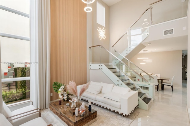 living room with a high ceiling