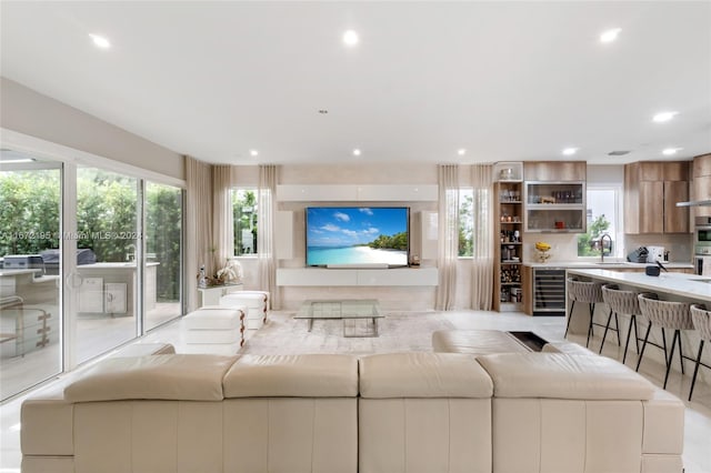 living room with wine cooler and sink