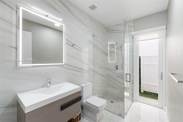 bathroom featuring an enclosed shower, vanity, and toilet