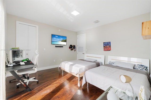 bedroom featuring dark hardwood / wood-style floors