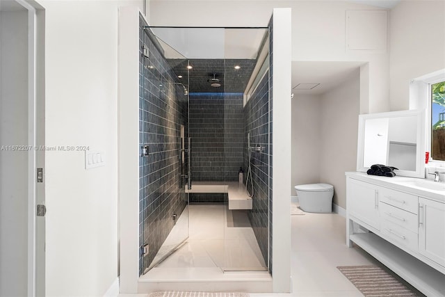 bathroom with tile patterned floors, a shower with door, vanity, and toilet