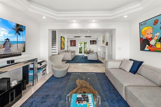 living room featuring a tray ceiling