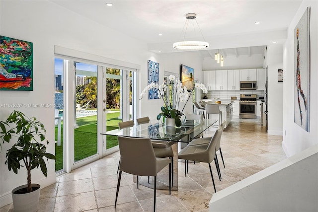 dining area featuring vaulted ceiling