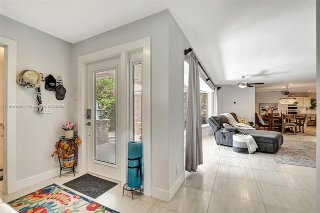 tiled entrance foyer featuring ceiling fan