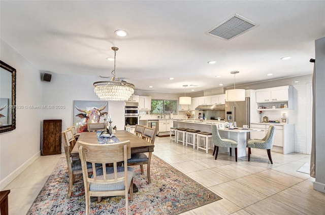 dining area featuring light tile patterned flooring