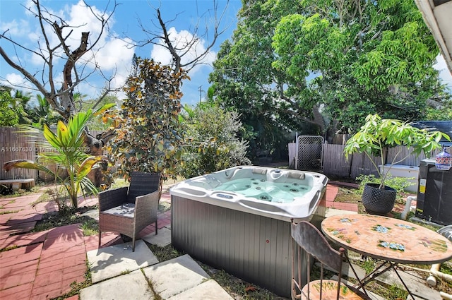 view of patio / terrace featuring a hot tub