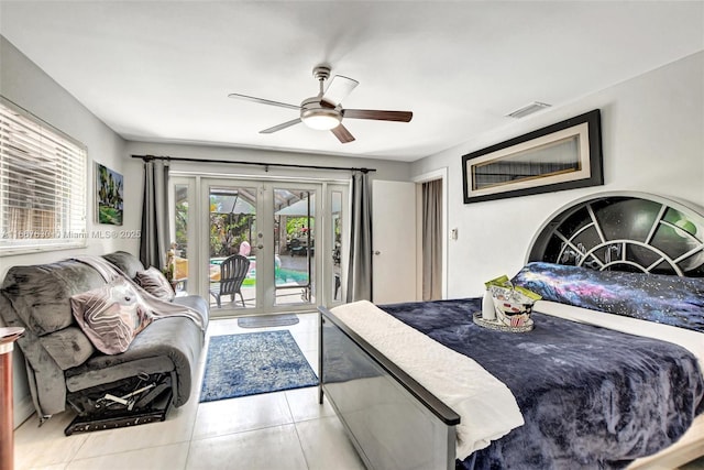 tiled bedroom with access to exterior, french doors, and ceiling fan