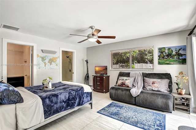 tiled bedroom featuring ceiling fan and connected bathroom