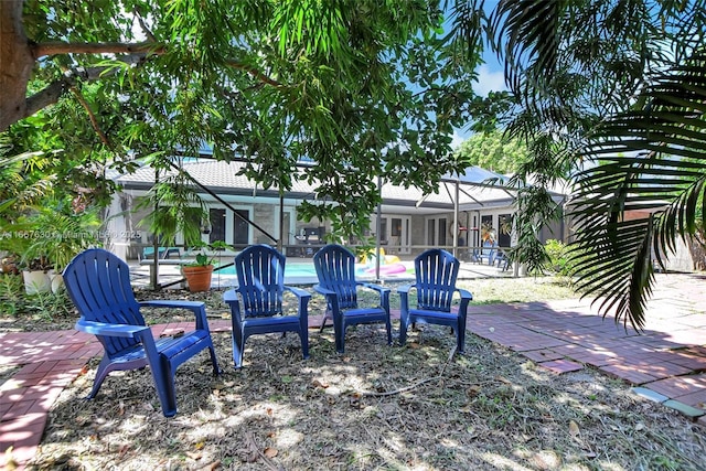 view of yard with a lanai and a patio