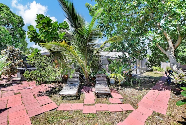 view of patio / terrace featuring a lanai