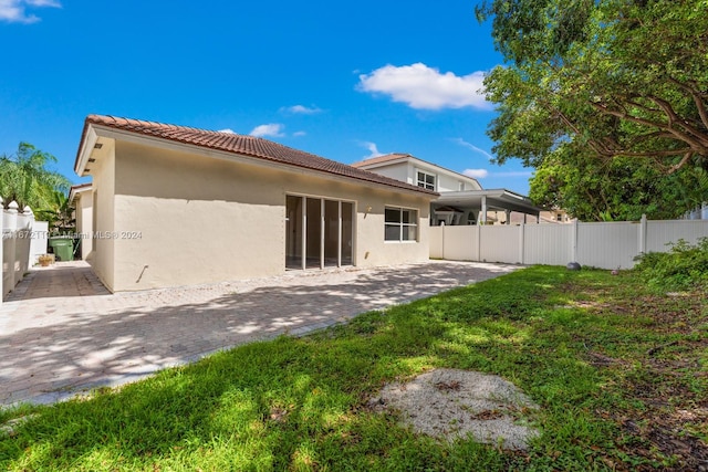 rear view of property with a patio area