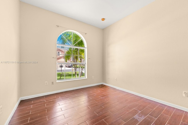 spare room featuring dark hardwood / wood-style flooring