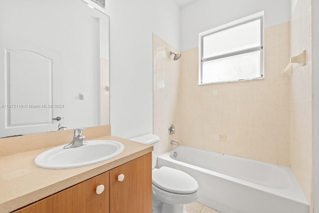 full bathroom featuring tile patterned flooring, vanity, toilet, and tiled shower / bath