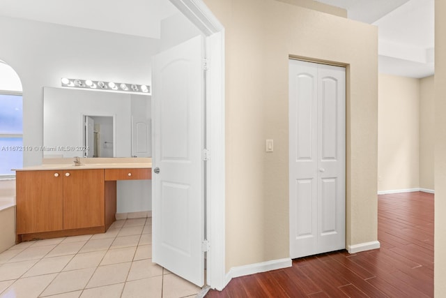 bathroom with wood-type flooring and vanity