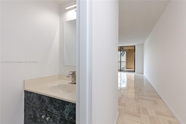 bathroom featuring tile patterned flooring and vanity