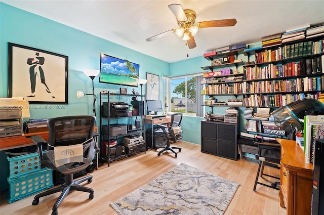 office space featuring ceiling fan and light hardwood / wood-style floors