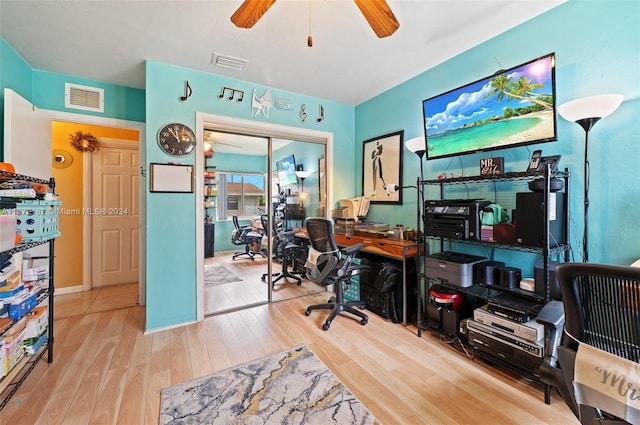 office area featuring light hardwood / wood-style flooring and ceiling fan