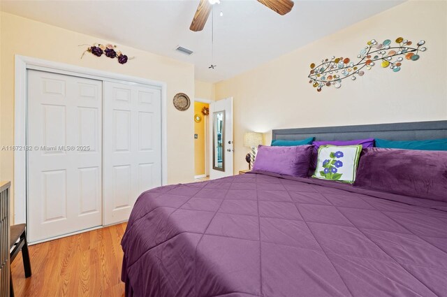 bedroom with ceiling fan and light hardwood / wood-style floors