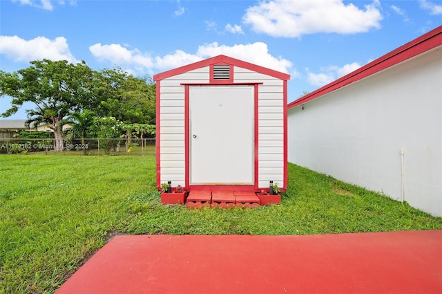 view of outdoor structure with a yard