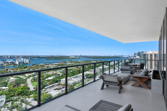 balcony featuring a water view