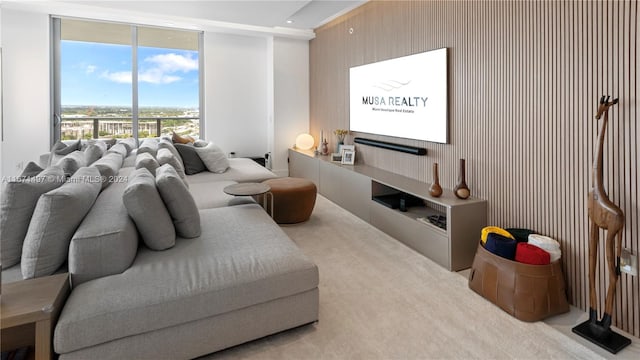 bedroom featuring a wall of windows and light carpet