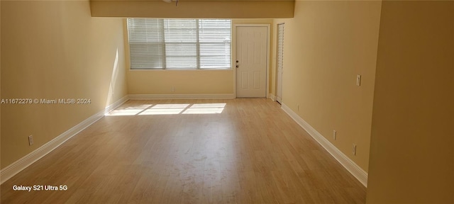 unfurnished room with light hardwood / wood-style flooring