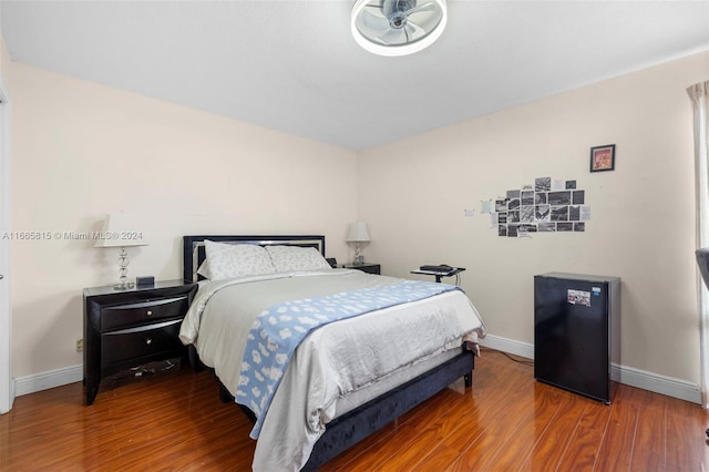 bedroom with hardwood / wood-style flooring