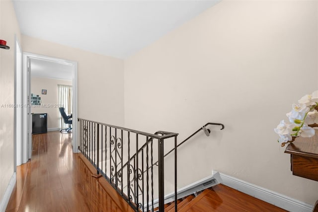 hallway with wood-type flooring