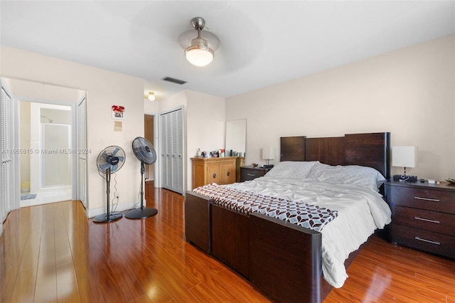 bedroom with ceiling fan and wood-type flooring