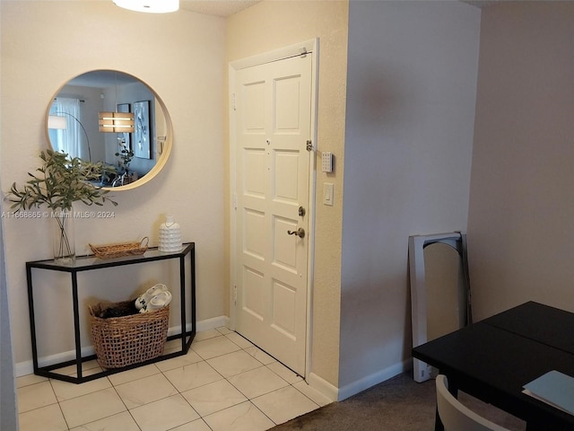 foyer featuring light tile patterned flooring