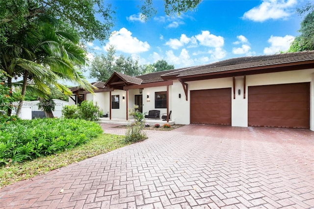 ranch-style home with a garage