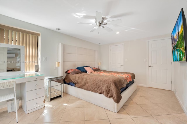 tiled bedroom featuring ceiling fan