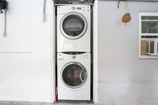 washroom with stacked washer / drying machine